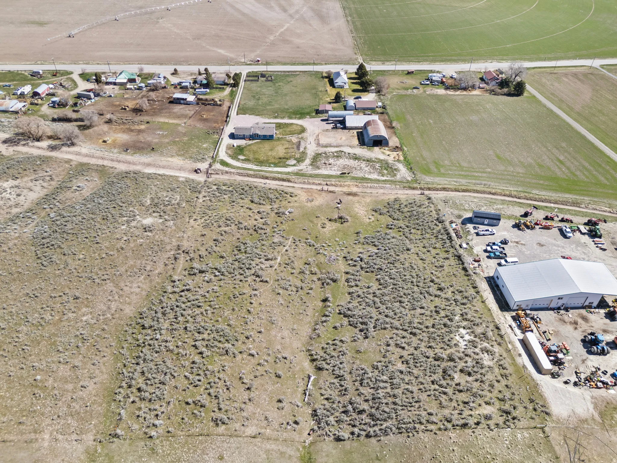 Aerial overview of property's location featuring rural landscape and rows of crops
