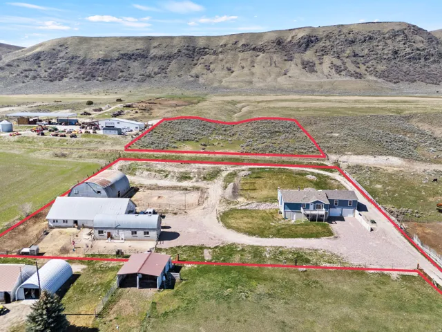 Overview of rural landscape with property boundaries highlighted and mountains