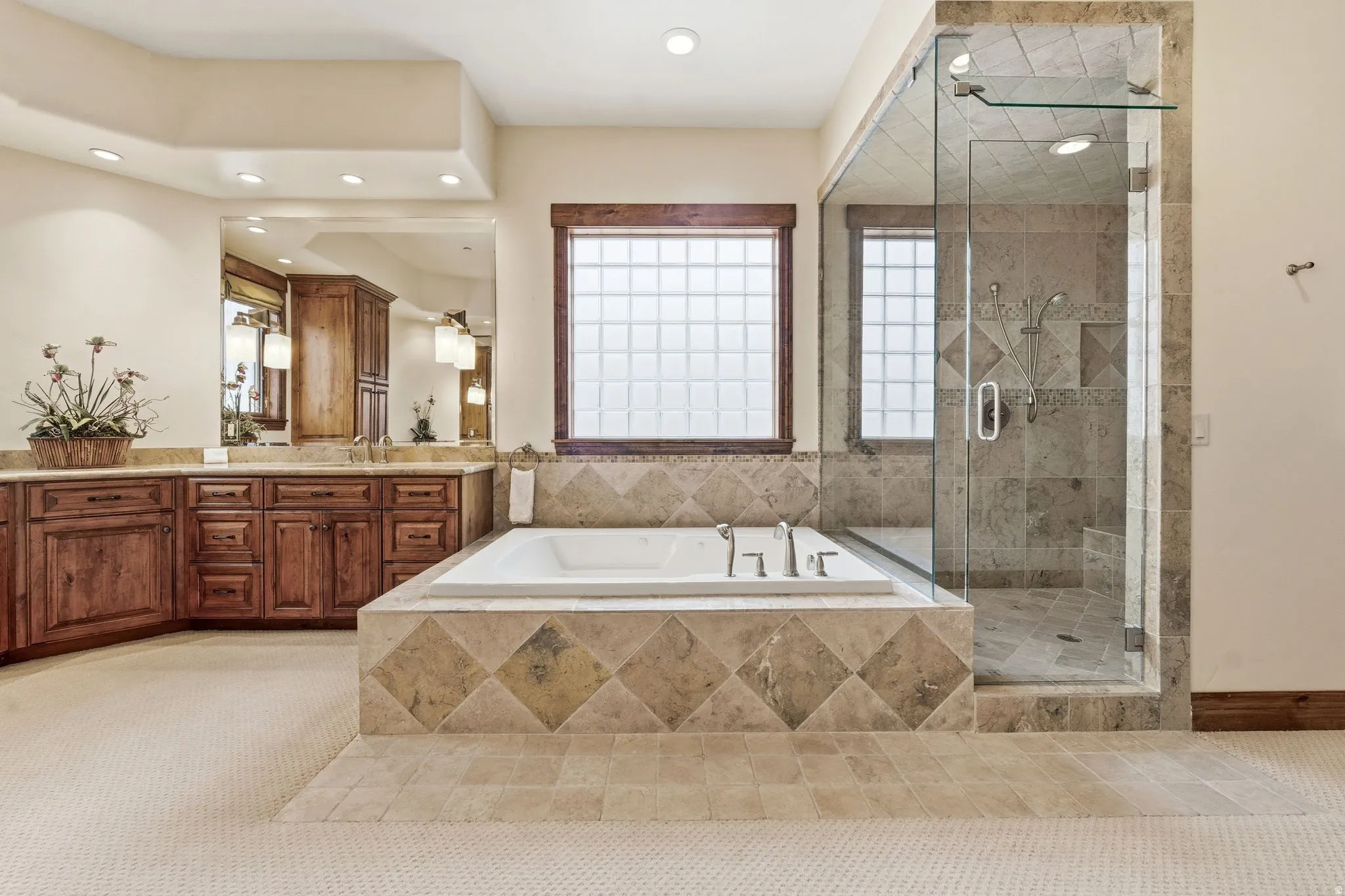 Bathroom with a stall shower, vanity, light tile patterned floors, a garden tub, and recessed lighting