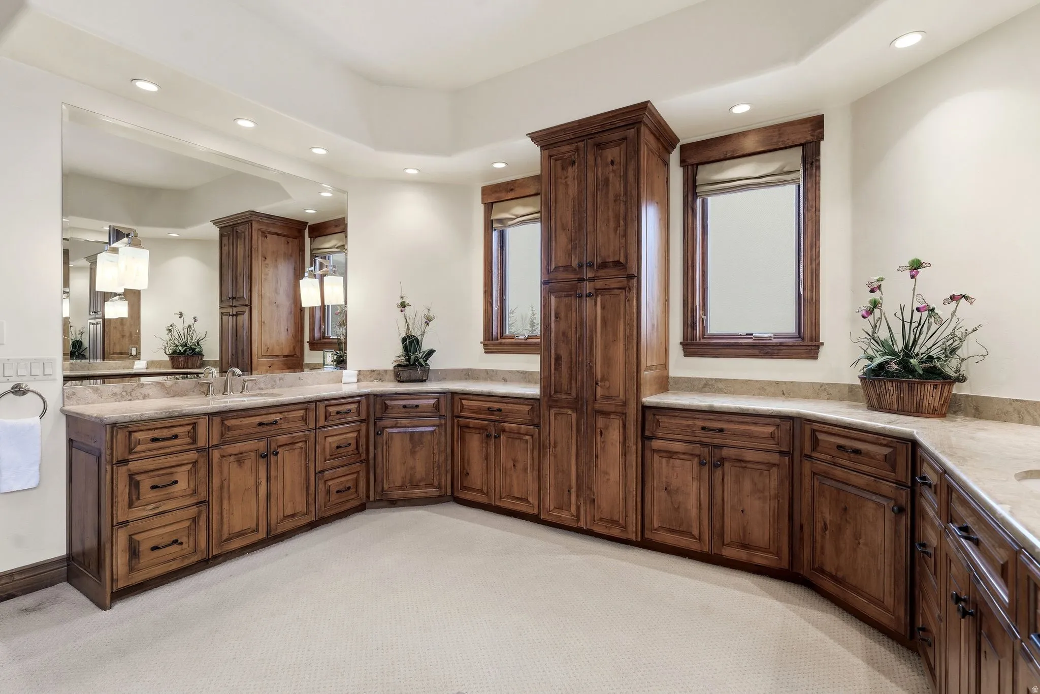 Full bathroom with vanity, a tray ceiling, light carpet, and recessed lighting