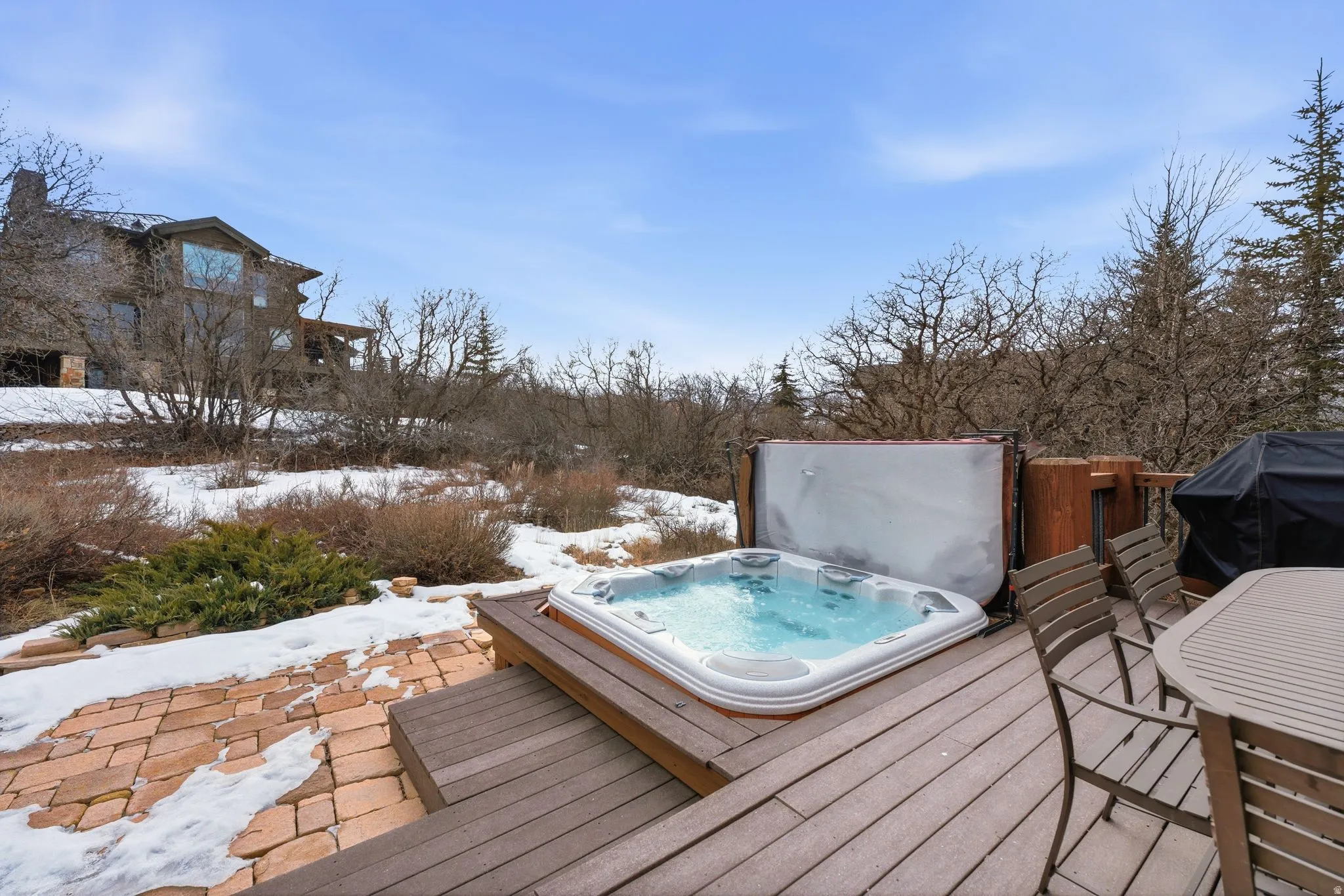 Wooden terrace featuring grilling area