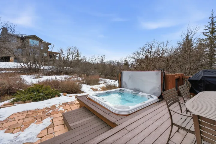 Wooden terrace featuring grilling area