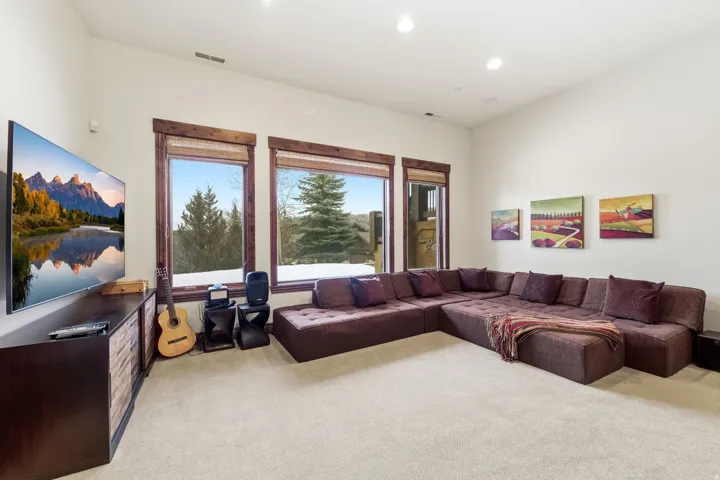 Living room featuring light carpet and recessed lighting