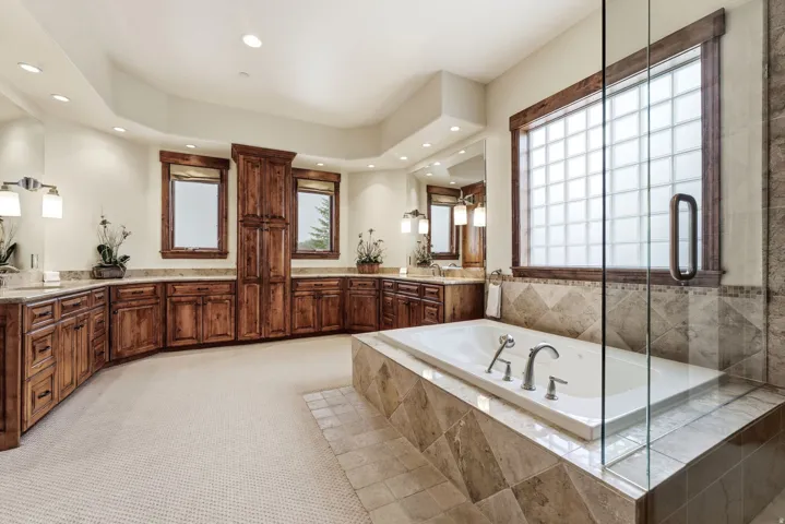 Full bathroom featuring light carpet, vanity, a garden tub, a shower stall, and recessed lighting