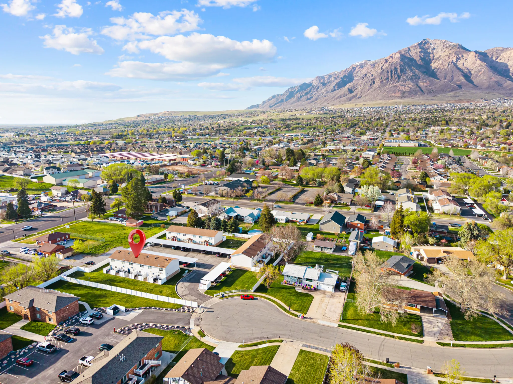Aerial perspective of suburban area with a mountain backdrop