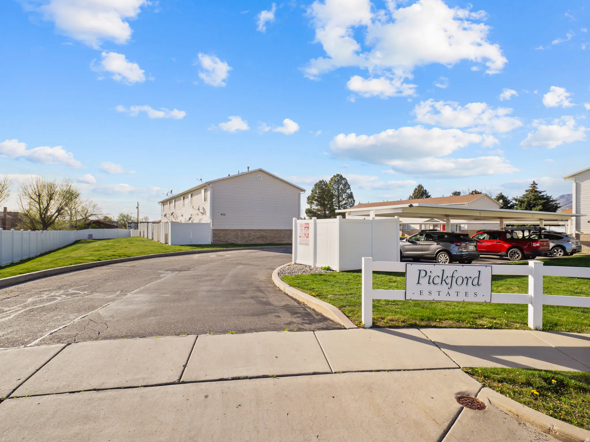 View of asphalt road with curbs