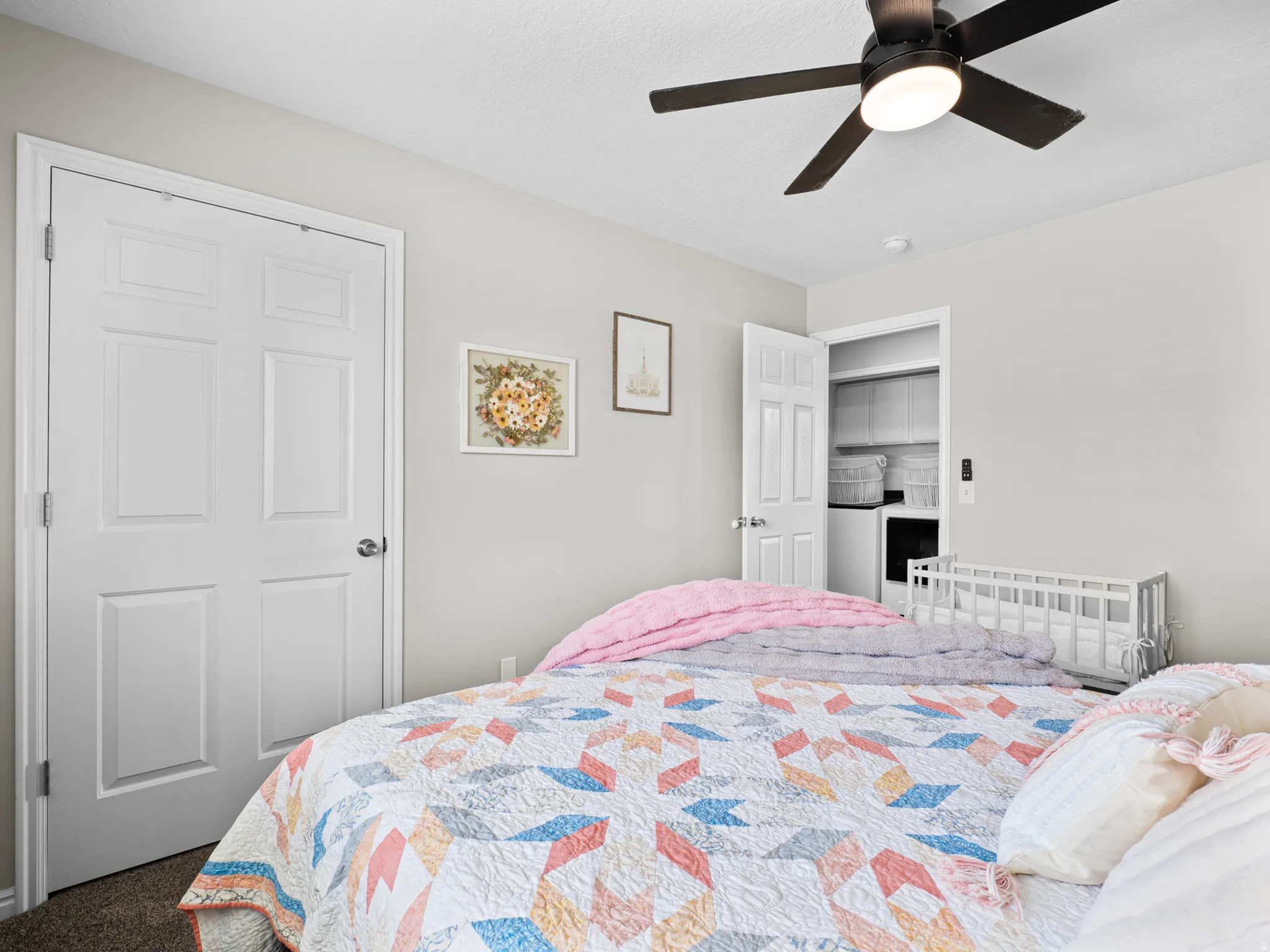 Bedroom with ceiling fan and carpet flooring