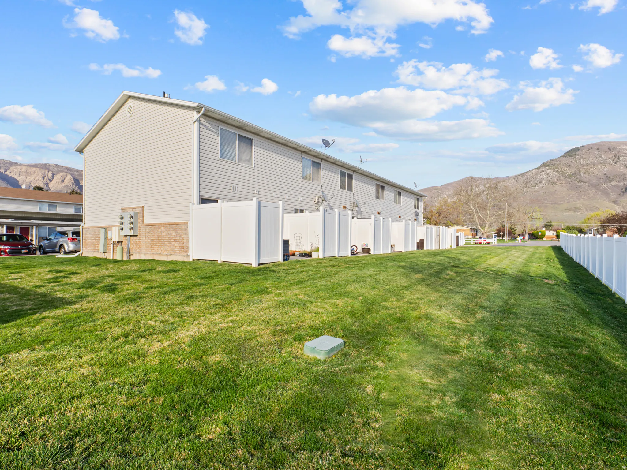 Rear view of property featuring a mountain view and brick siding