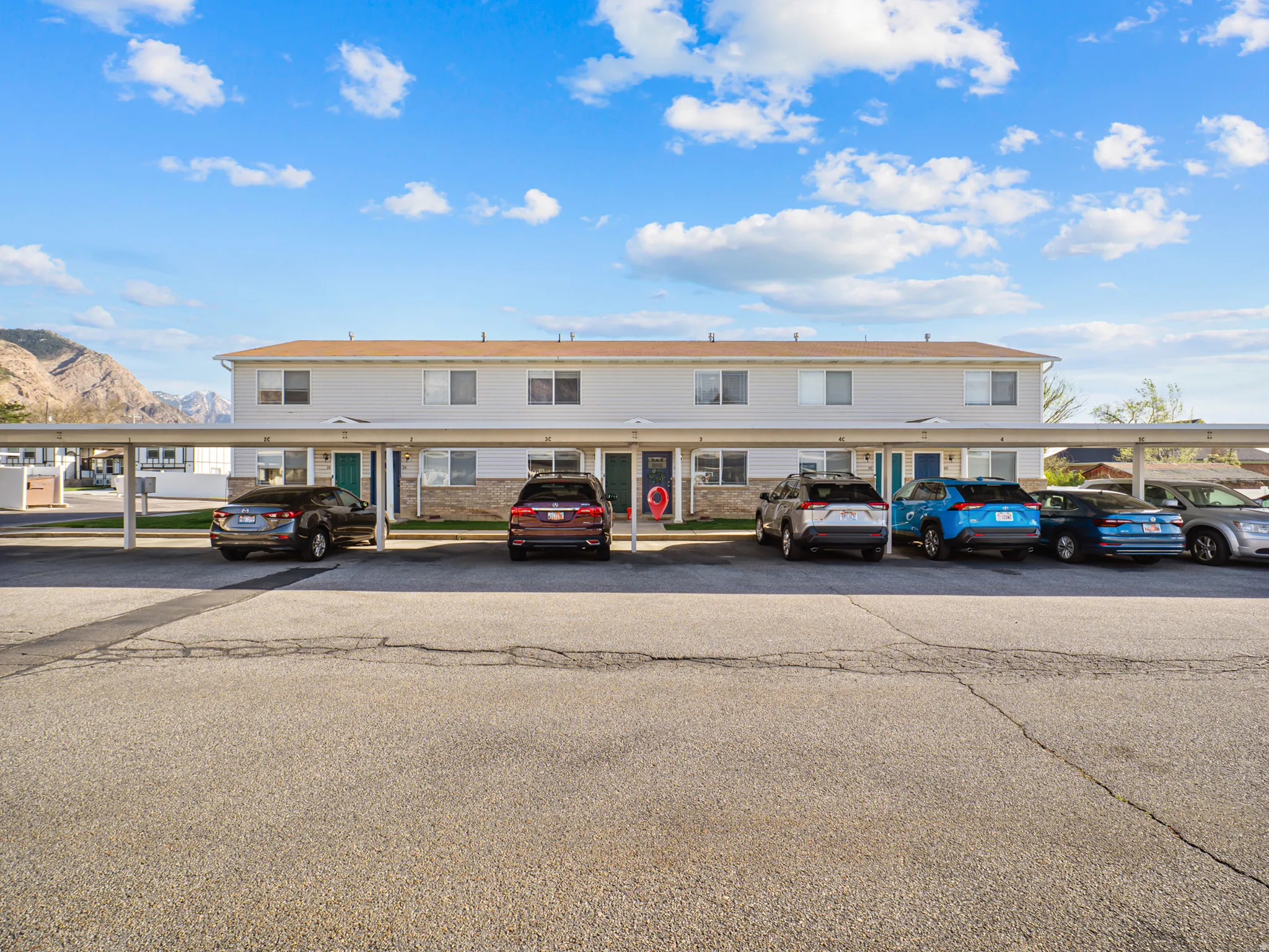 View of front of house featuring covered parking and a mountain view