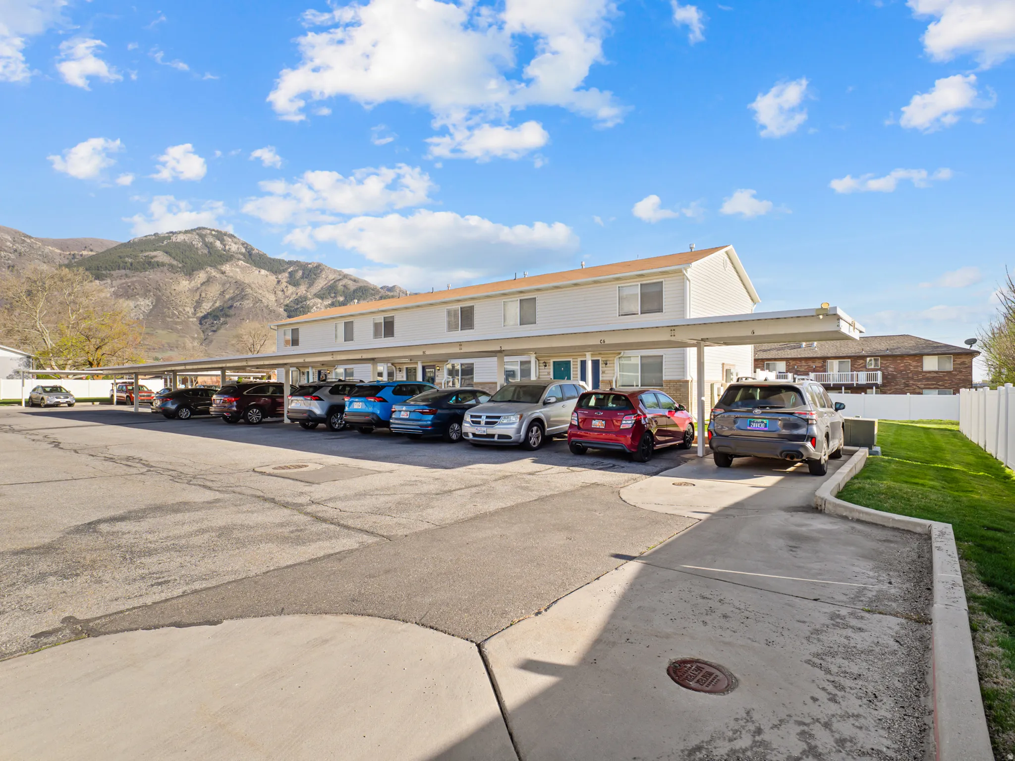 Covered parking lot featuring a mountain view