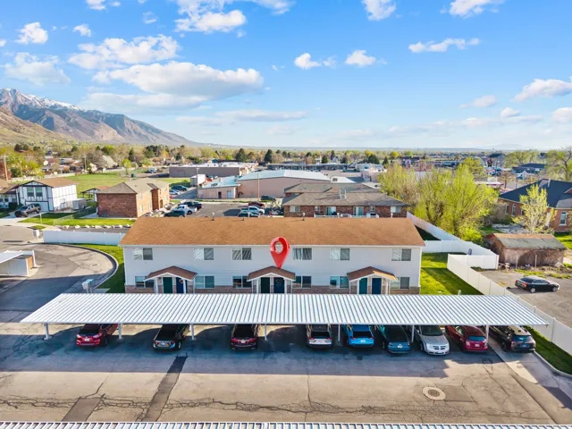Aerial perspective of suburban area featuring a mountain backdrop