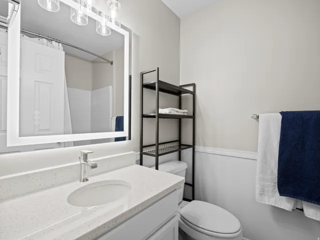 Bathroom with vanity and a shower with shower curtain