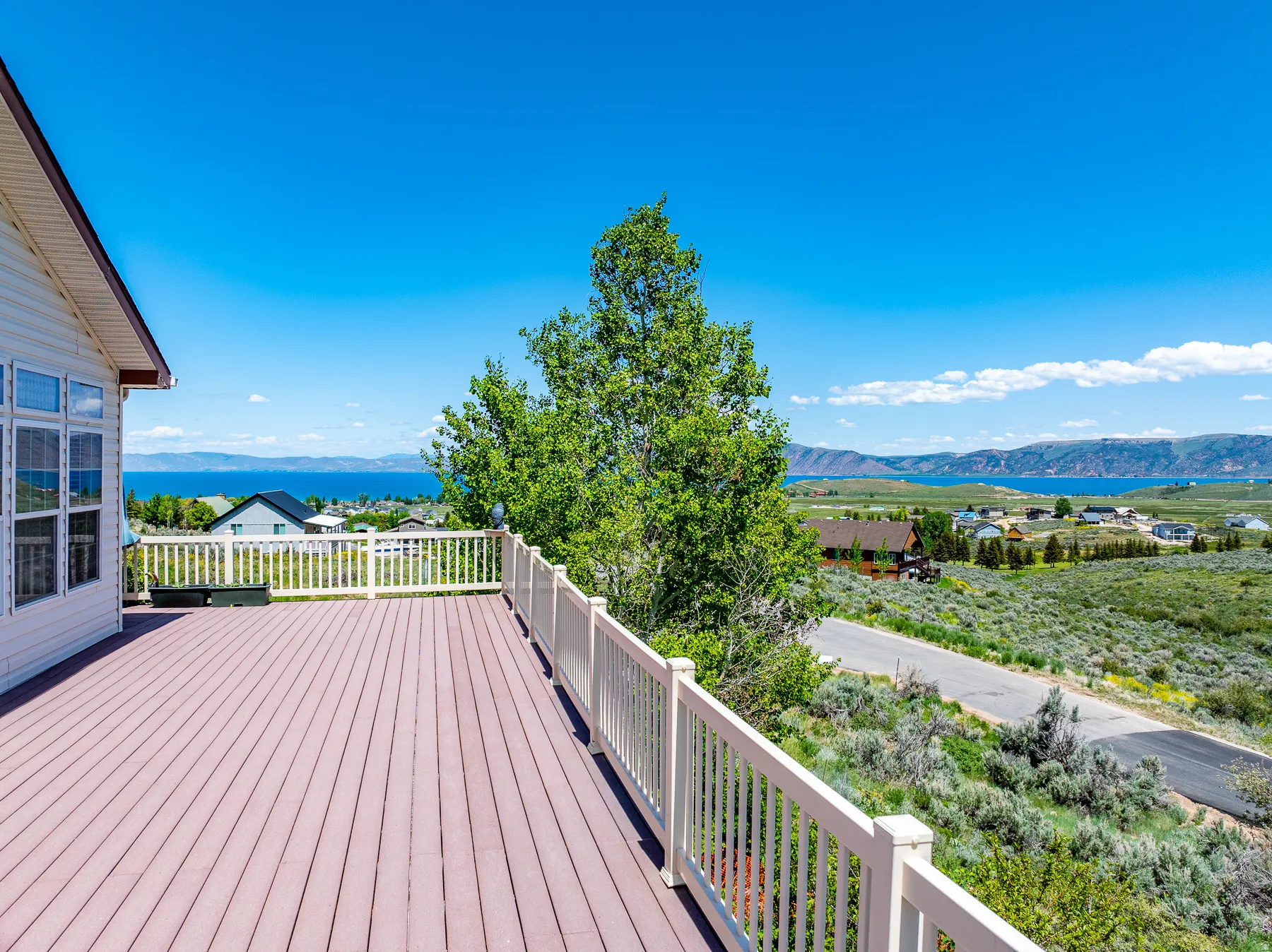 Deck with a mountain and lake view