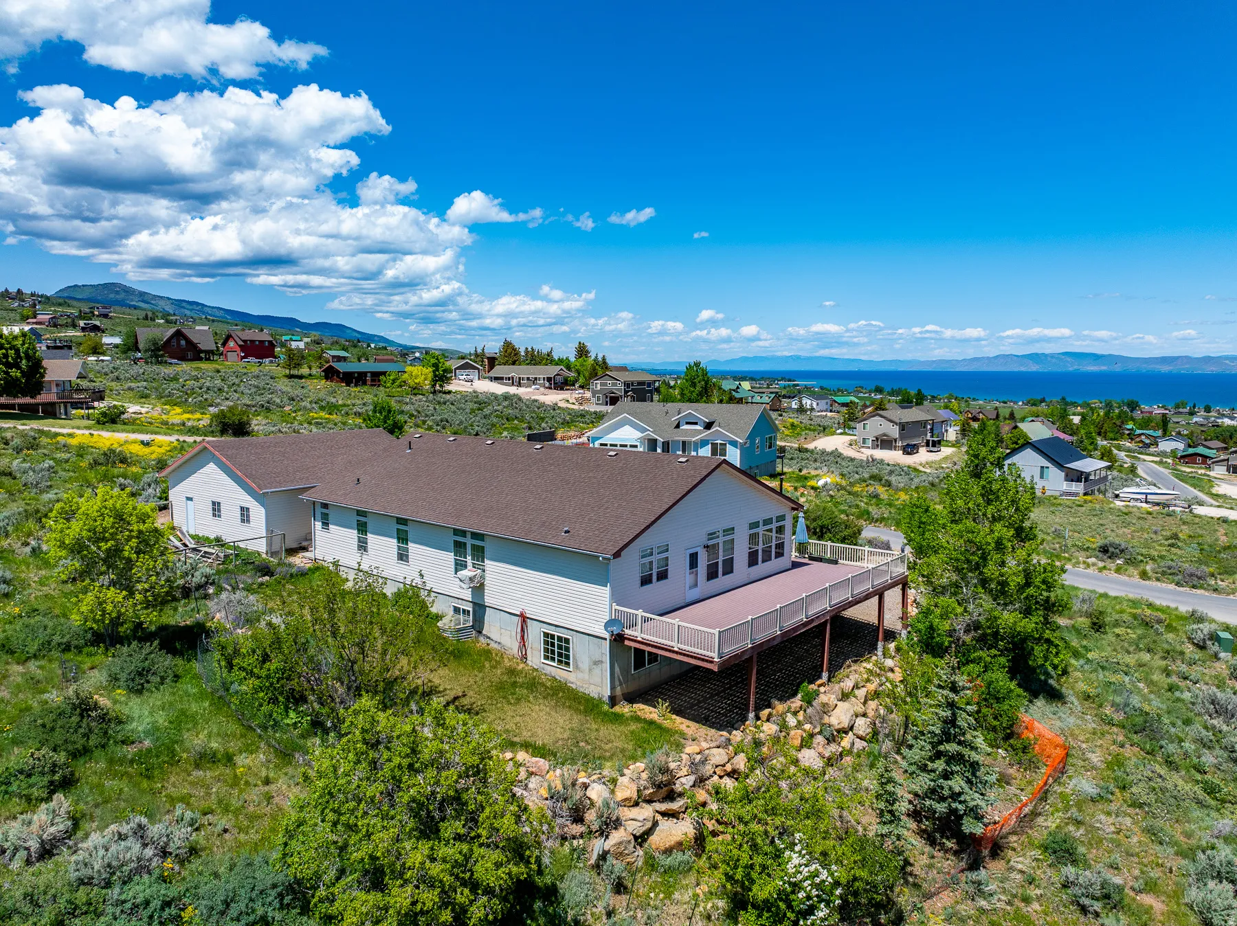 Aerial view of residential area featuring a mountain backdrop