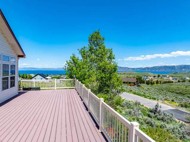 Deck with a mountain and lake view