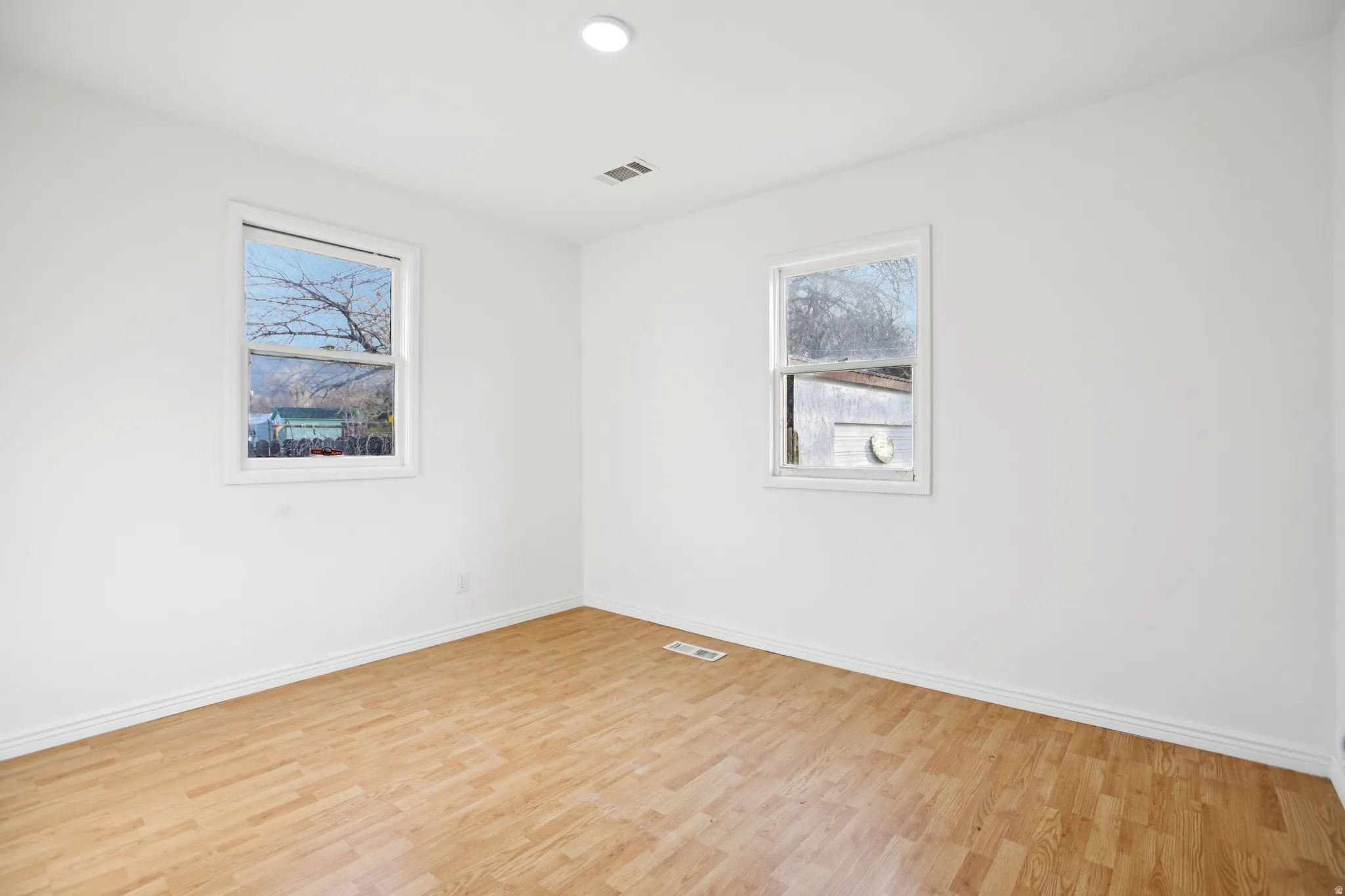 Unfurnished room featuring light wood-type flooring and recessed lighting