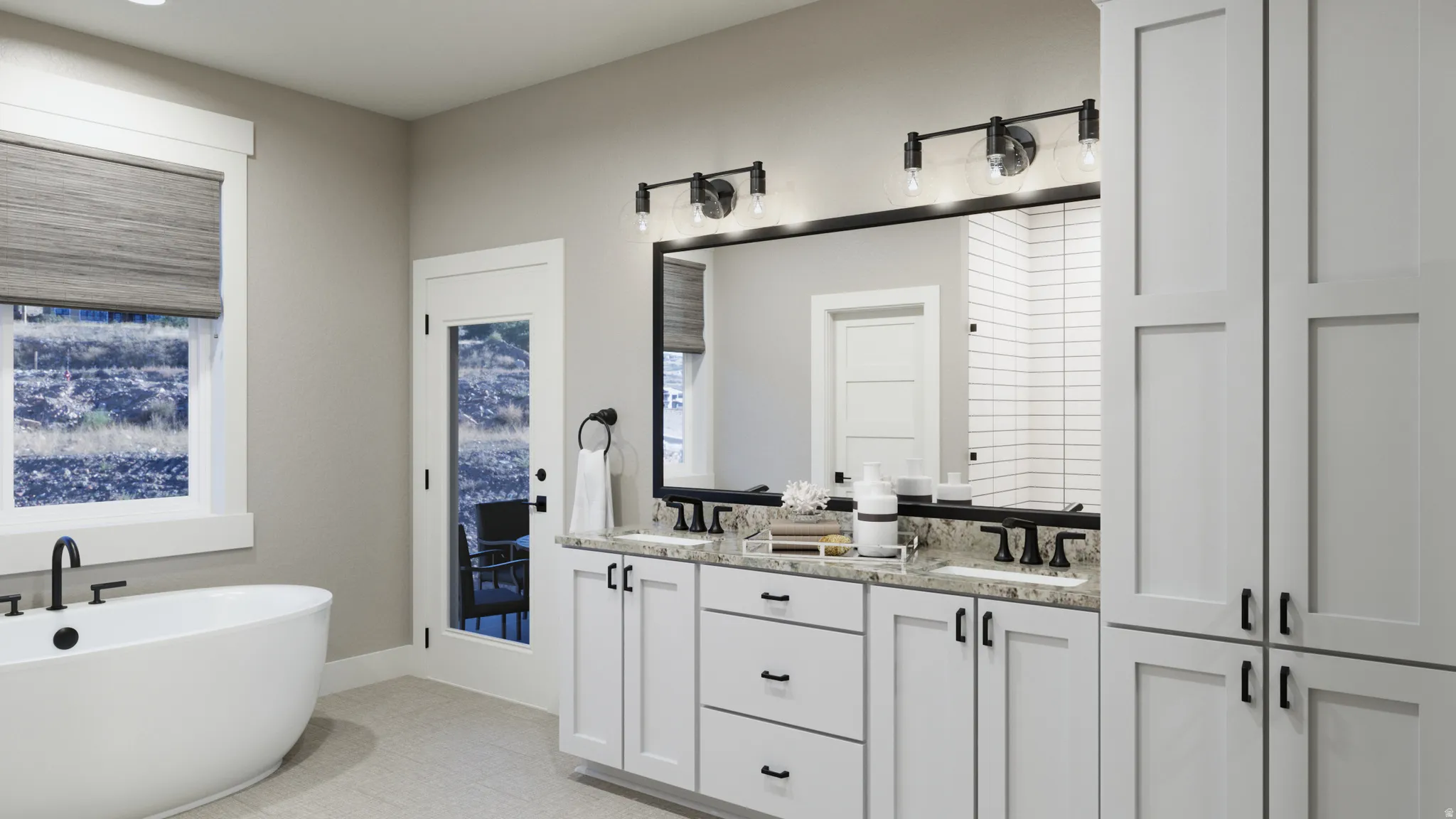 Bathroom featuring double vanity and a freestanding bath