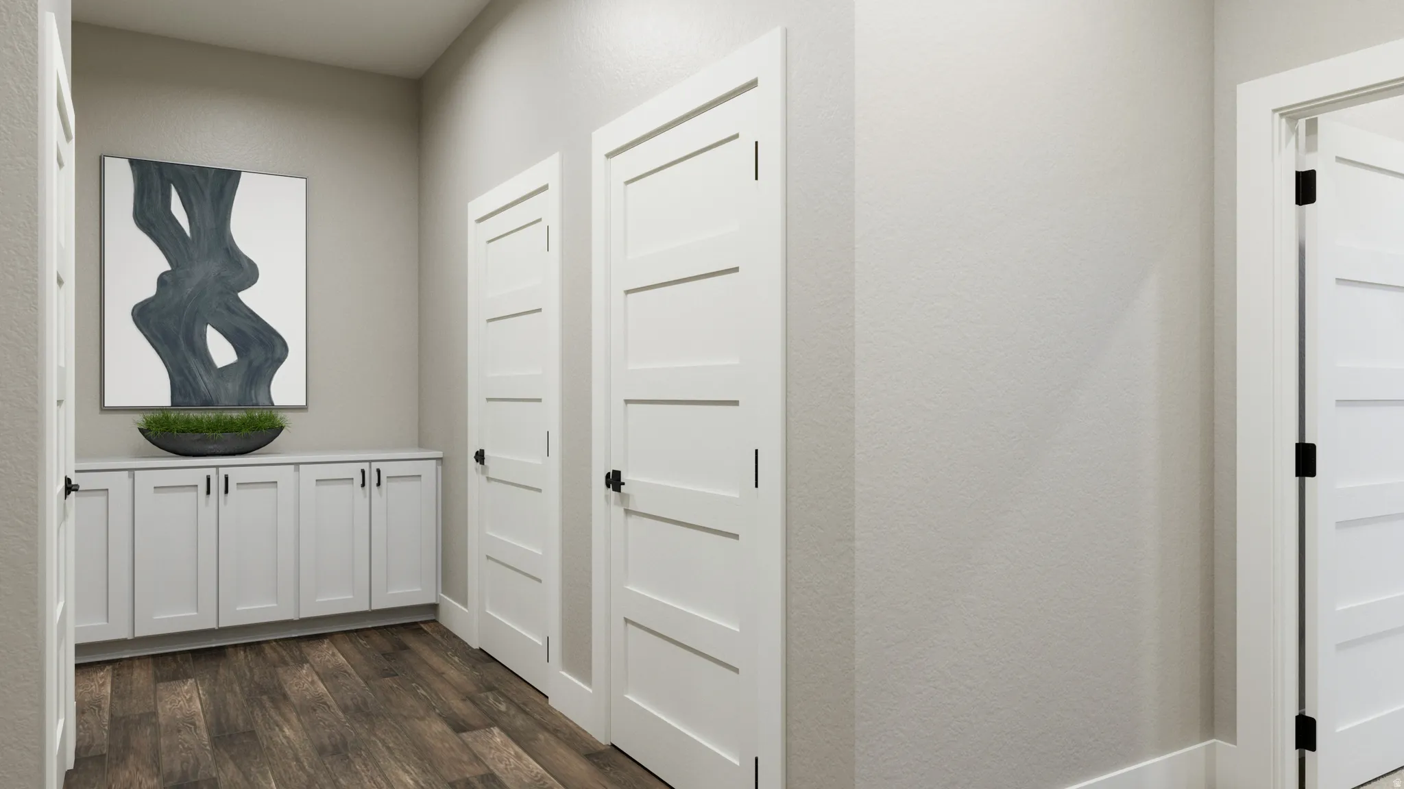 Corridor featuring dark wood-type flooring and a textured wall