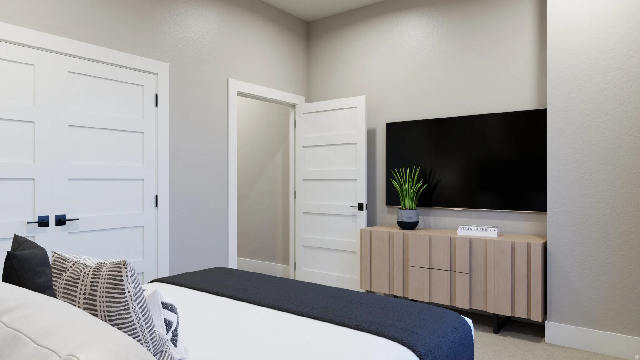 Bedroom featuring light carpet and a textured wall
