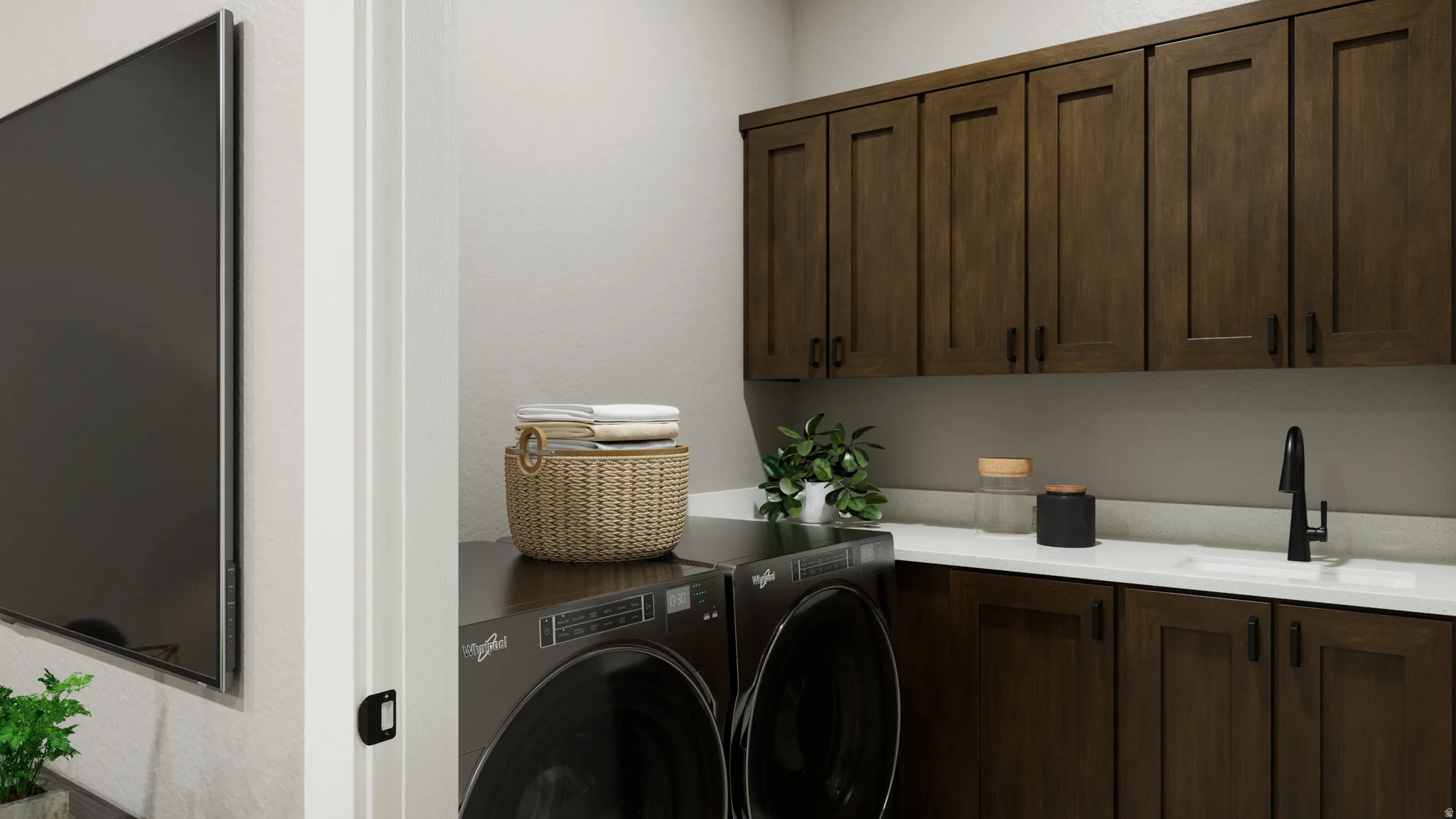 Laundry room featuring cabinet space and washing machine and clothes dryer