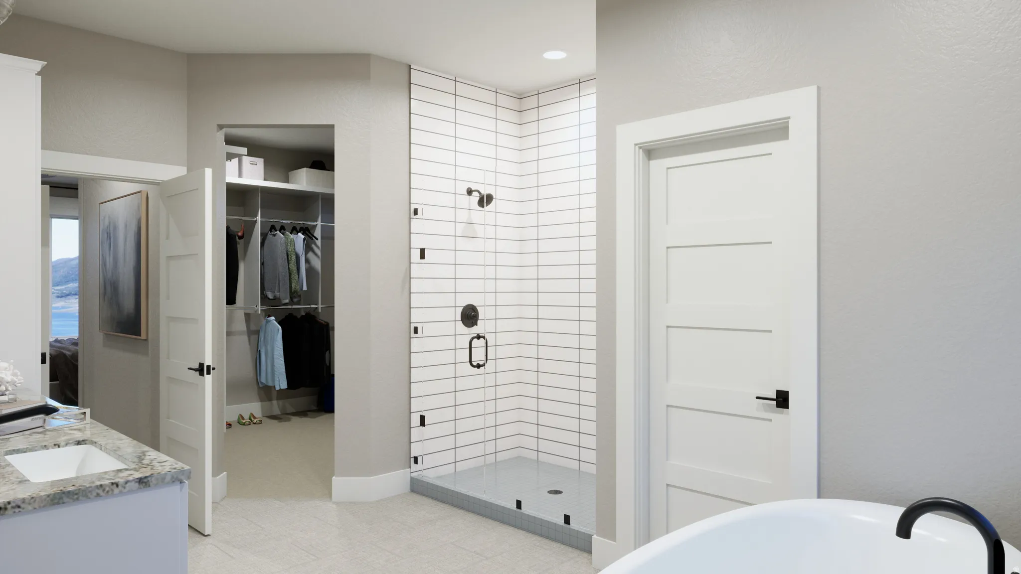 Bathroom with a stall shower, double vanity, a textured wall, a spacious closet, and a freestanding bath