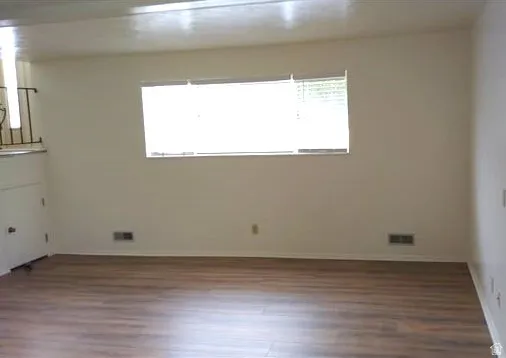 Family Room (unoccupied, with updated flooring)