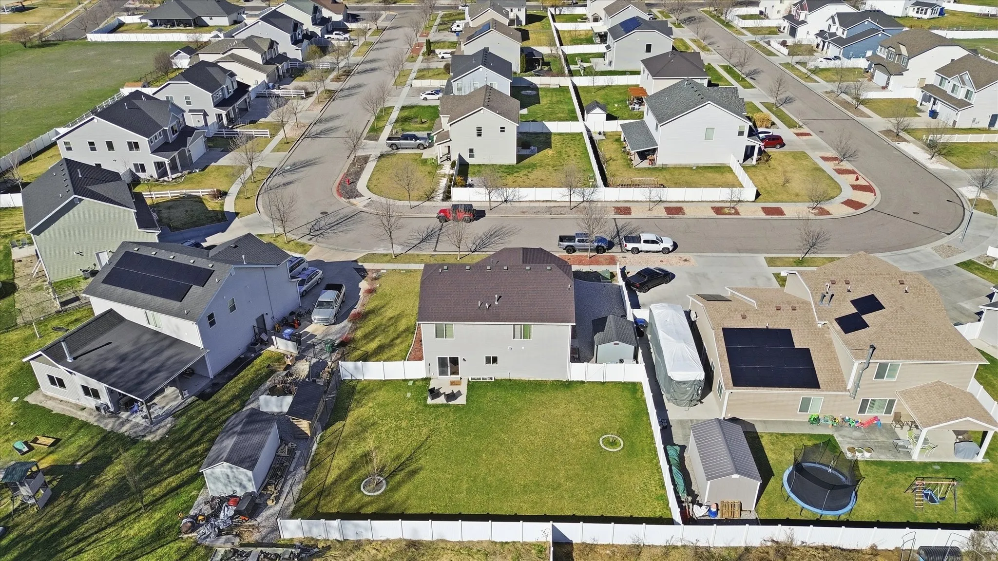 Aerial view of property's location with nearby suburban area