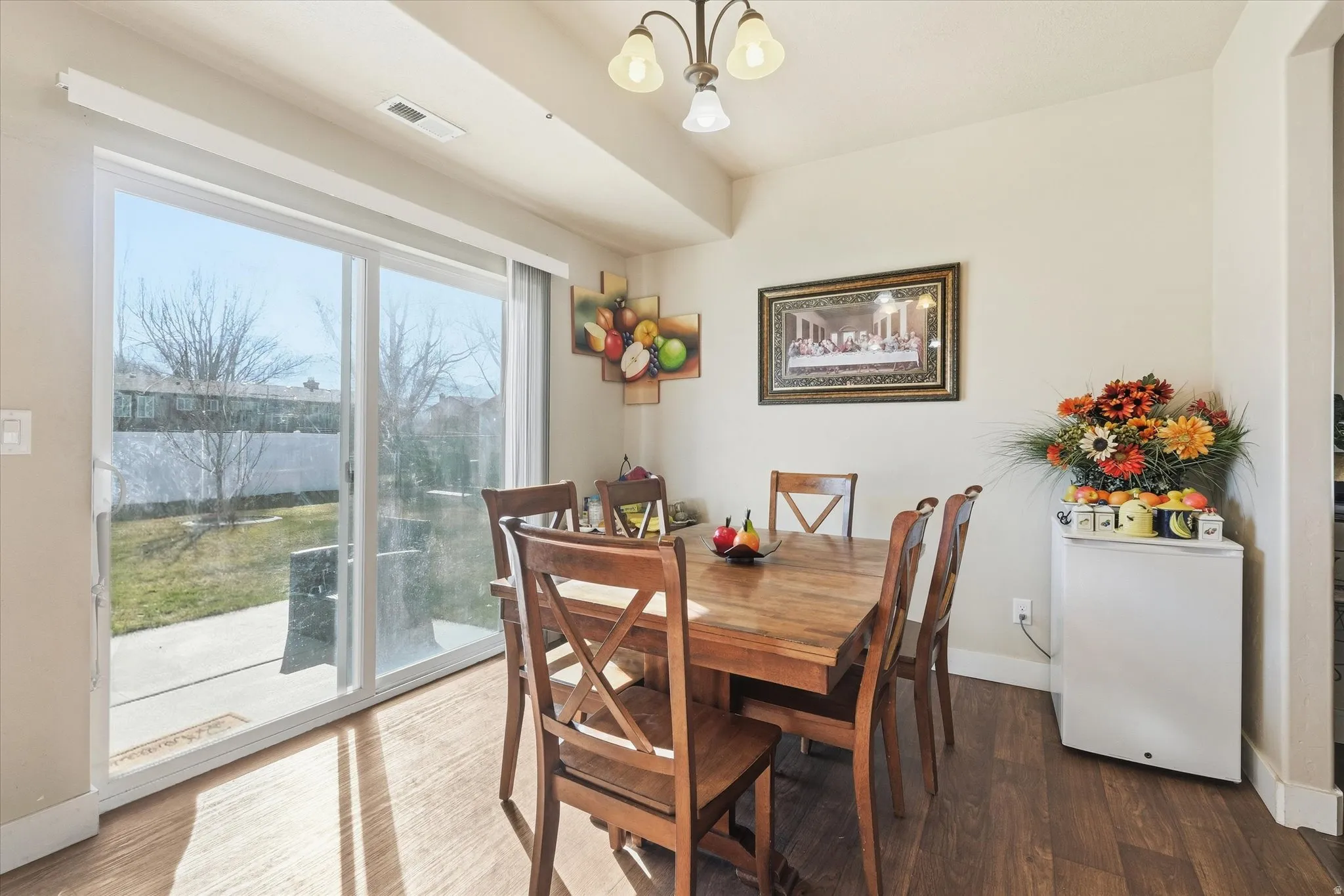Dining area featuring a chandelier and wood finished floors