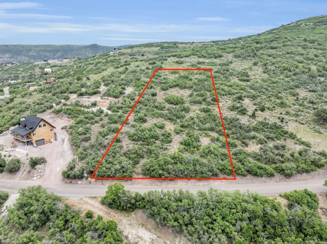 View of rural area featuring property boundaries highlighted and a mountain backdrop