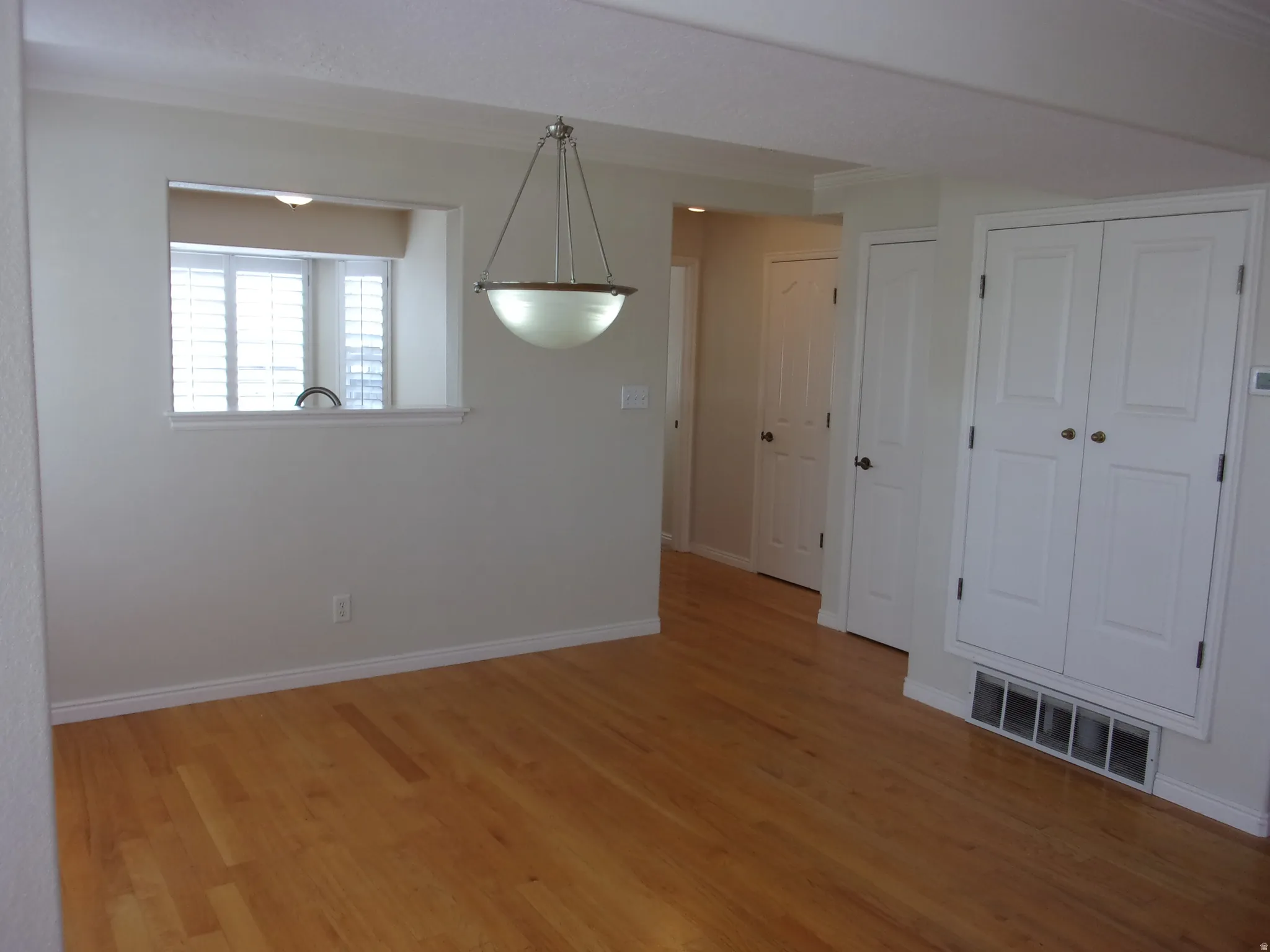 Unfurnished dining area with light wood-style floors