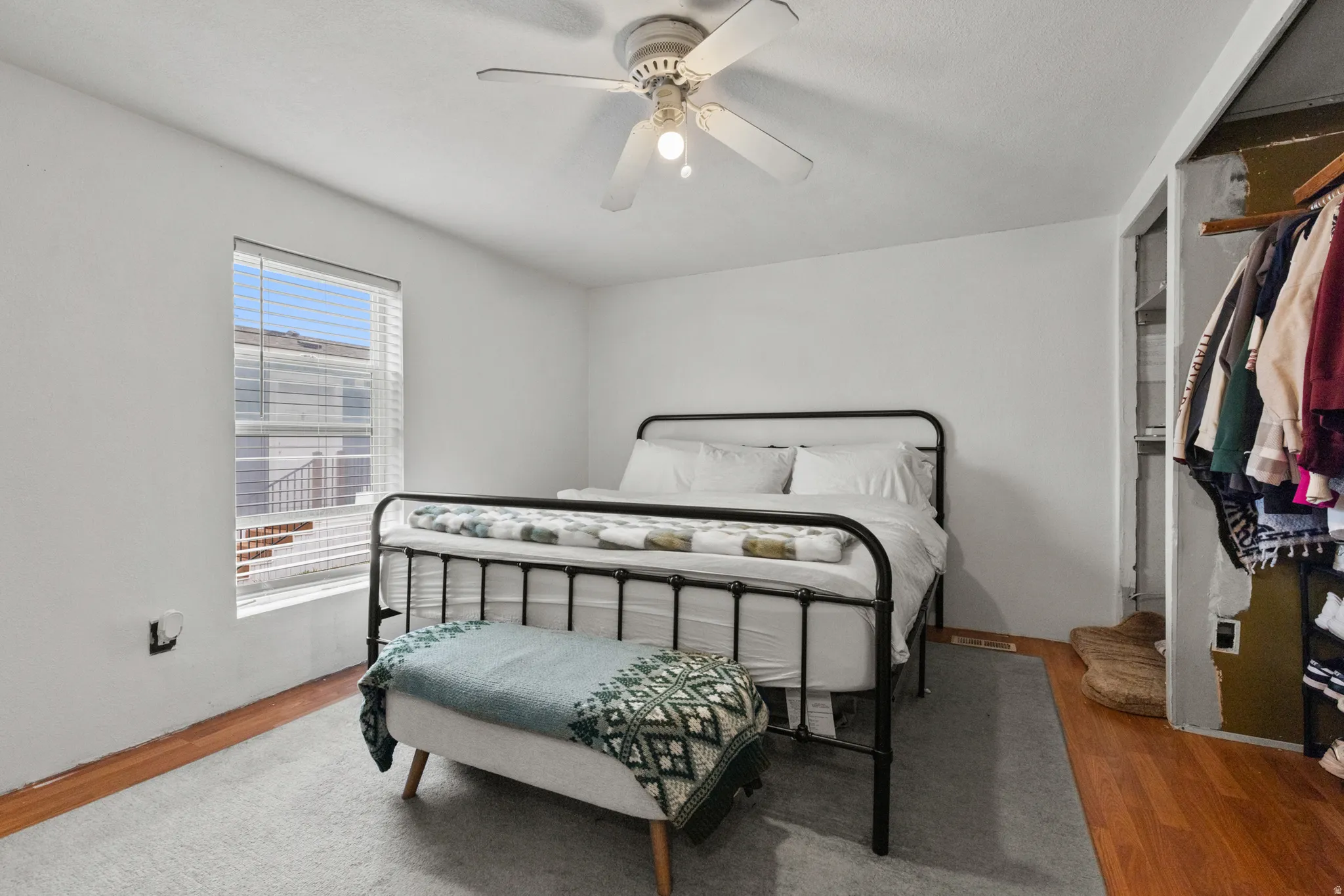 Bedroom with wood finished floors and ceiling fan