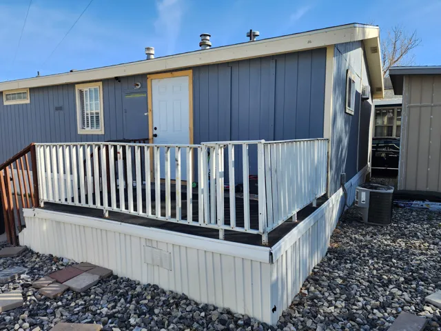 Back of house with a wooden deck