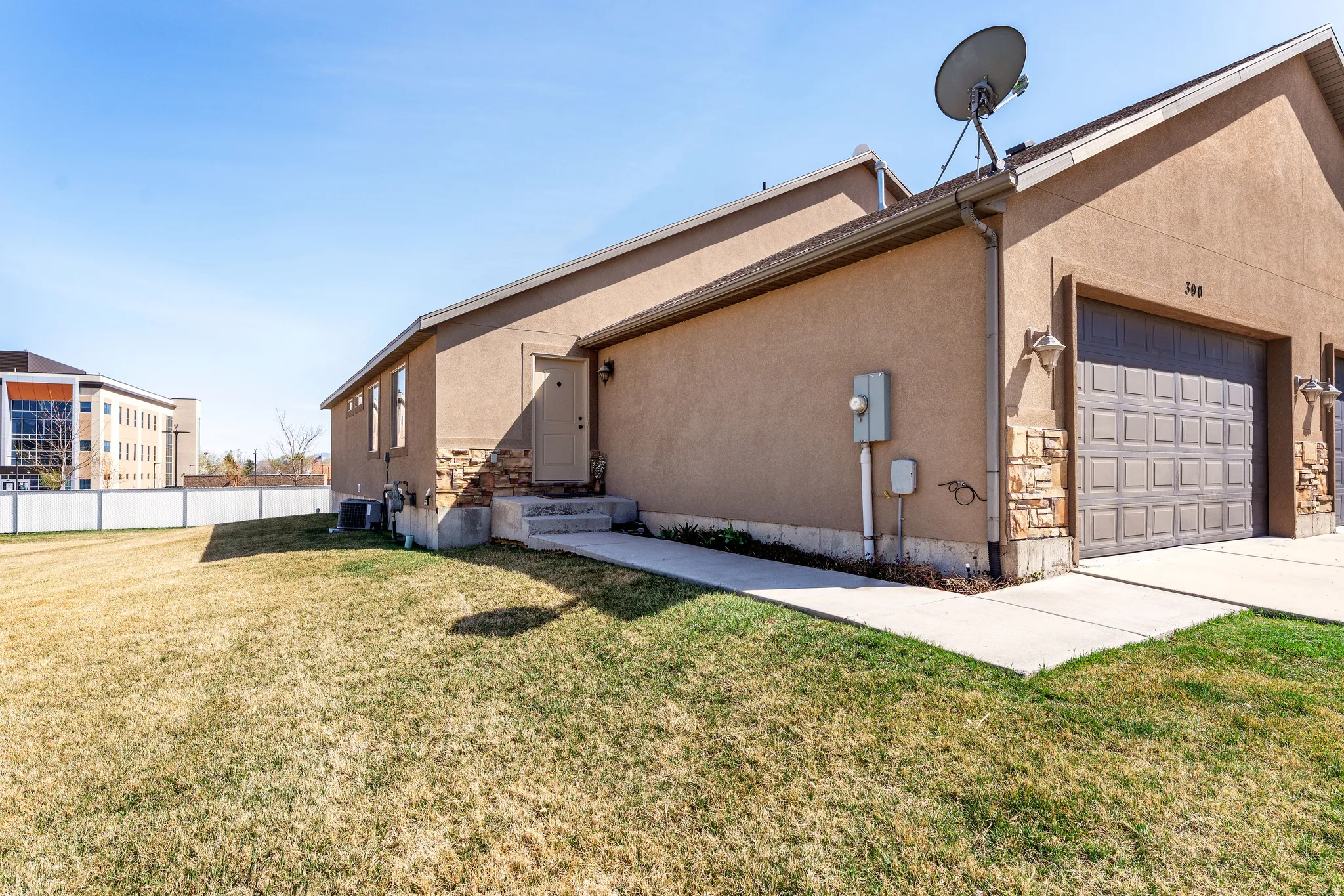View of property exterior featuring stucco siding and a garage