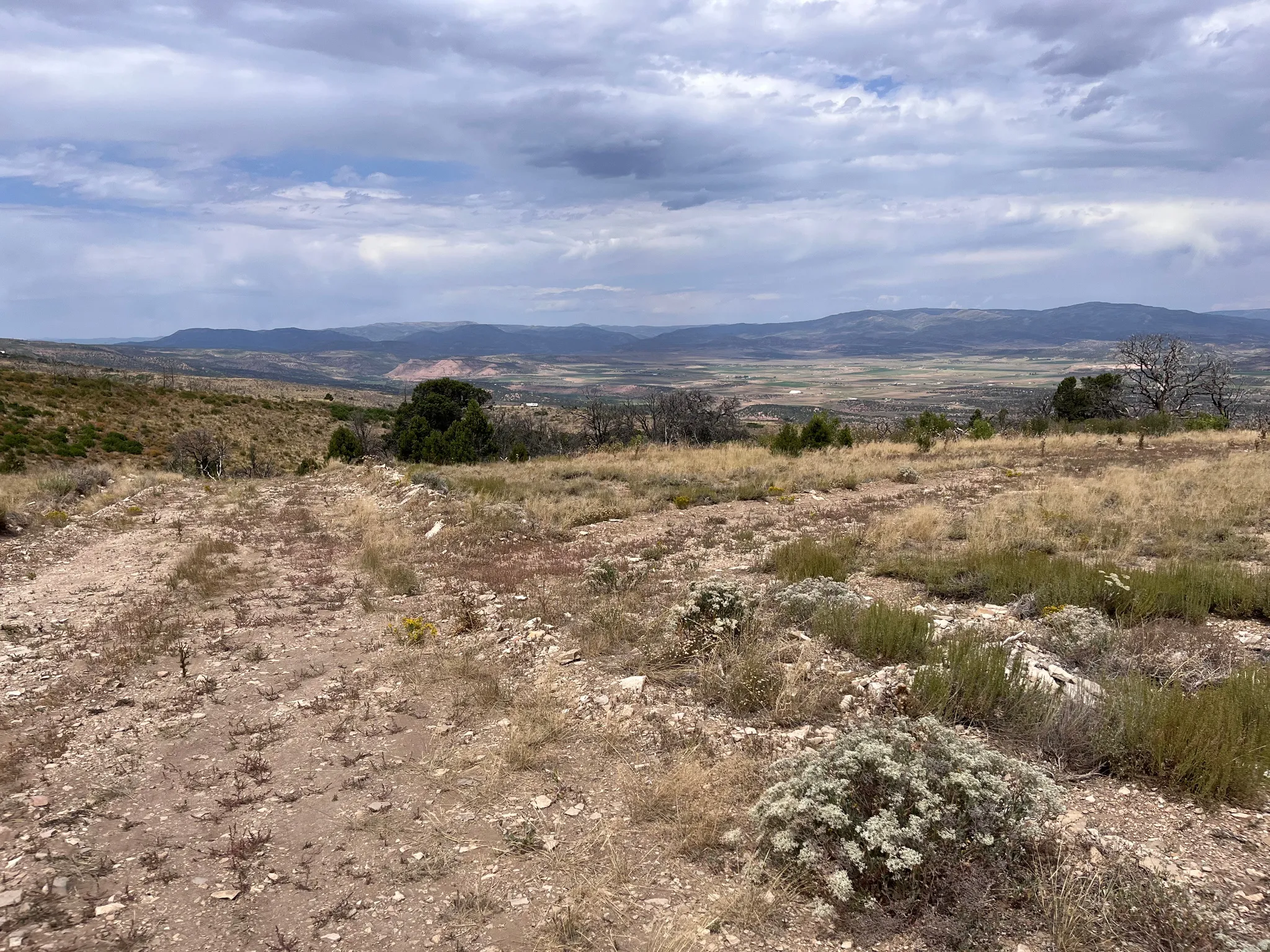 View of mountain backdrop with rural landscape
