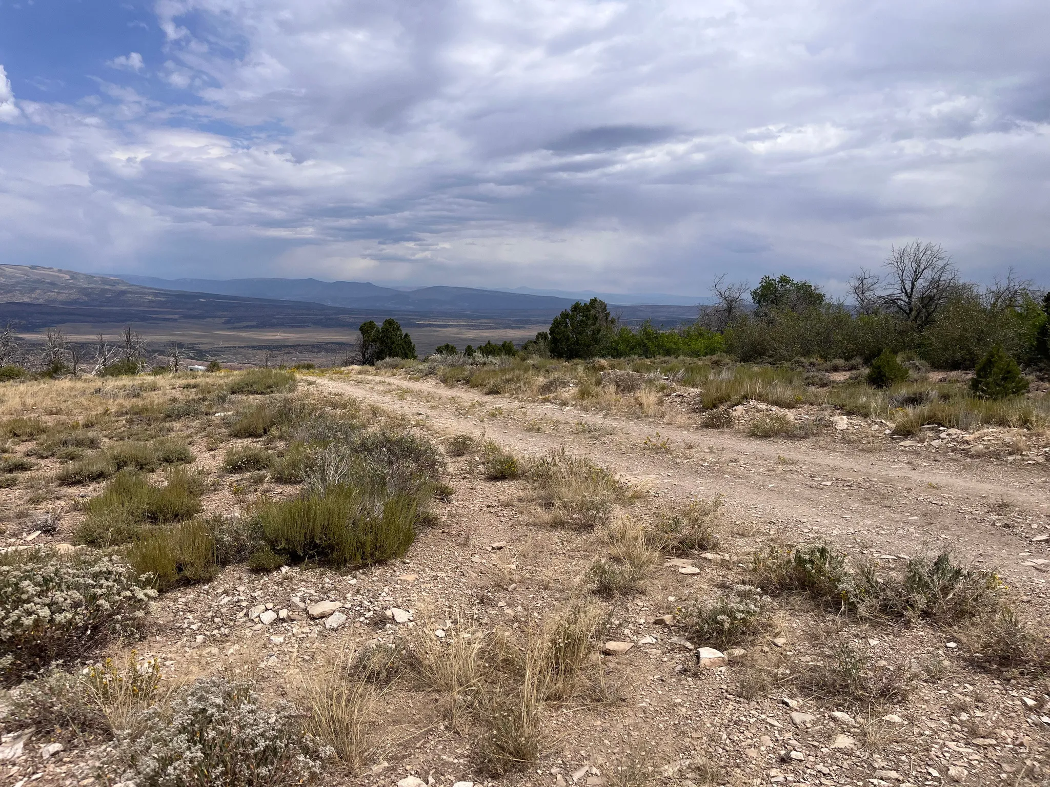 View of mountain background featuring rural landscape