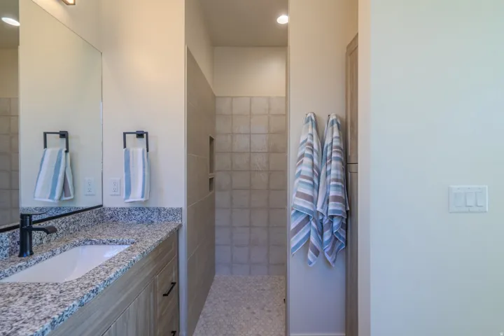 Full bath featuring vanity and a walk in shower