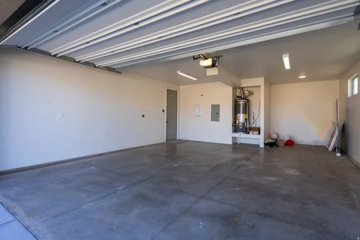 Garage with electric panel and water heater