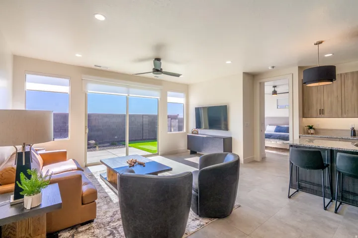 Living area with a ceiling fan and recessed lighting
