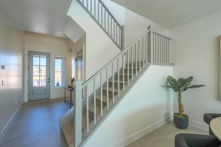 Stairs with tile patterned floors