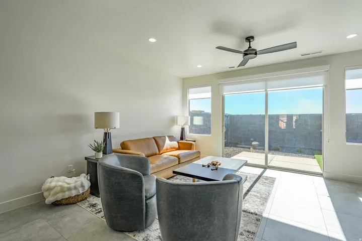 Living room featuring ceiling fan and recessed lighting