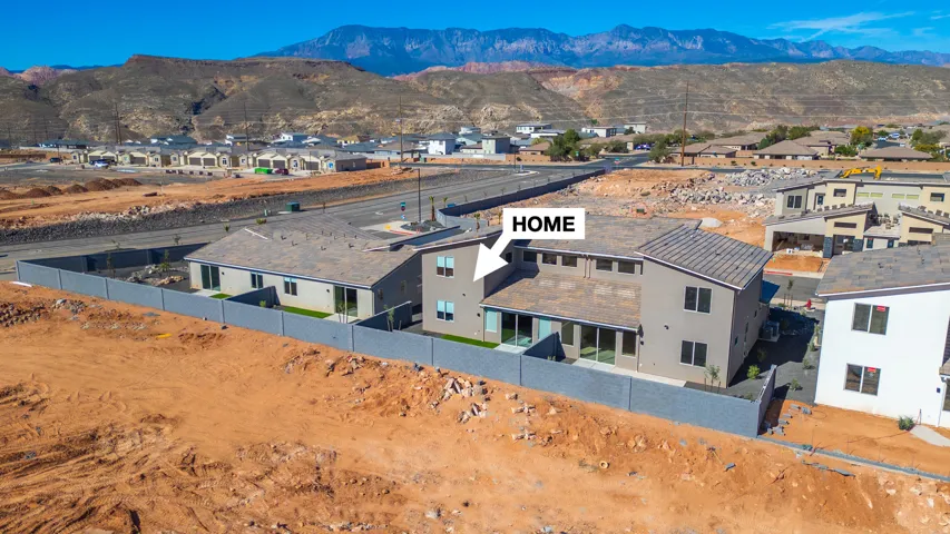 Aerial view of residential area featuring mountains