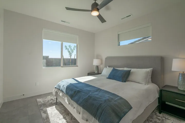 Bedroom featuring baseboards and ceiling fan