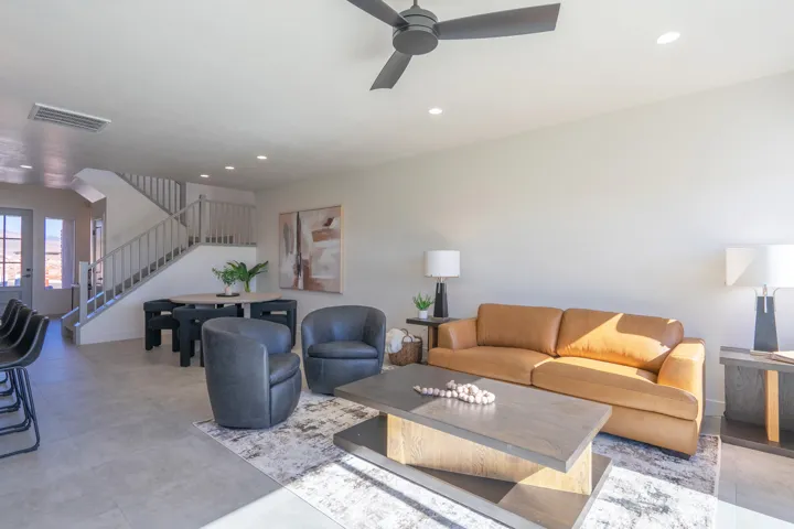 Living area with recessed lighting and a ceiling fan