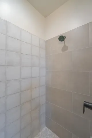 Bathroom featuring tiled shower
