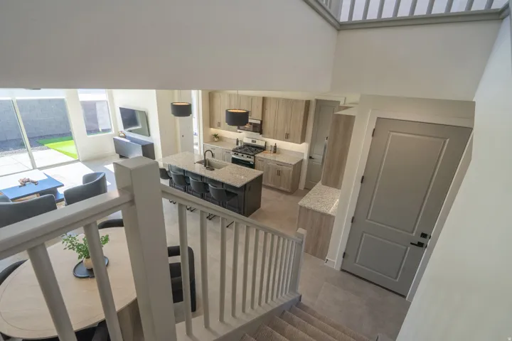 Stairs featuring a high ceiling