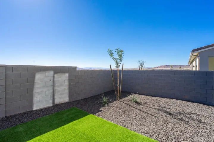 Fenced backyard with a mountain view