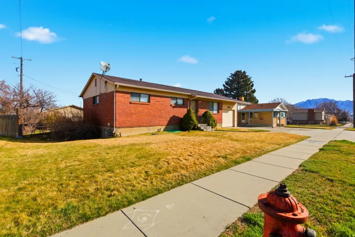 Ranch-style house with brick siding and a mountain view