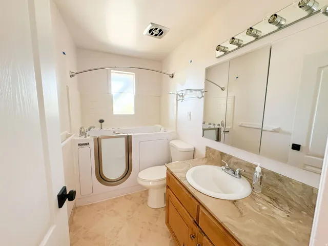 Full bathroom featuring vanity and bathtub / shower combination
