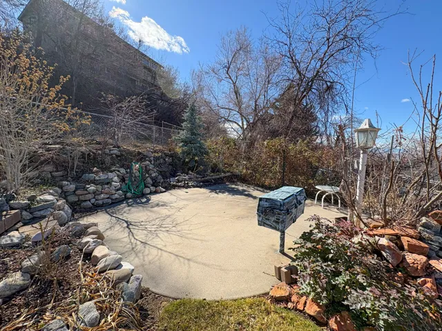 View of yard featuring a patio with view overlooking valley and lake