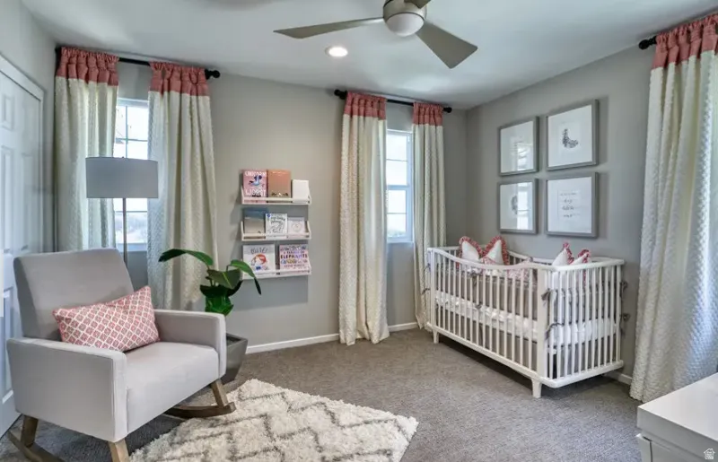 Bedroom light colored carpet, windows, and recessed lighting. Pictures are of a model home only! This home may feature different finishes than what is pictured.